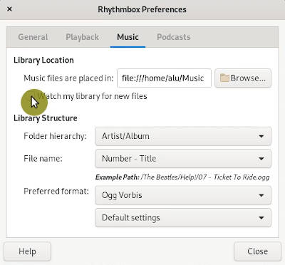 watch library for new files option in Rhythmbox